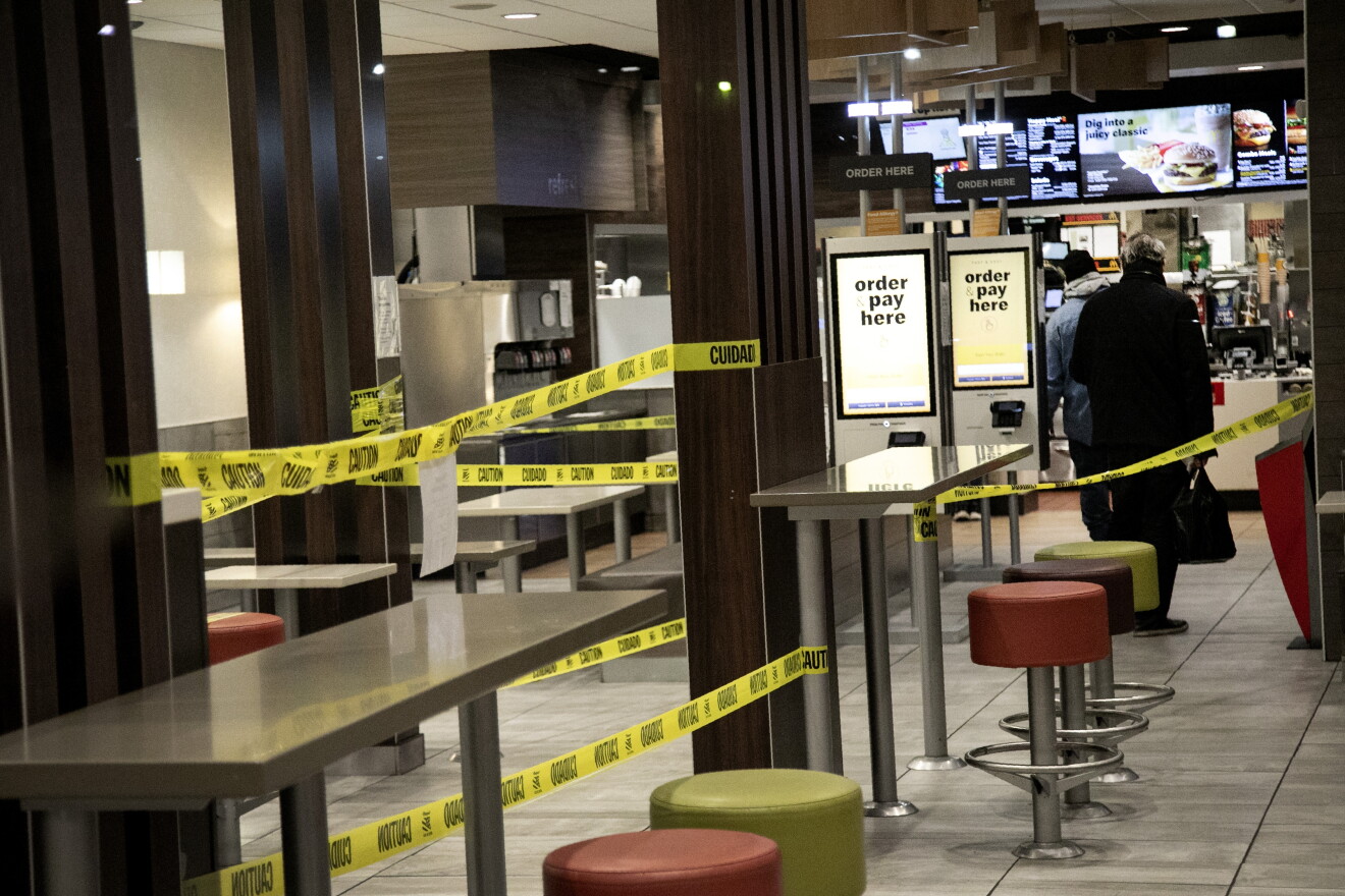 People stand in line for their order at a McDonald's restaurant Wednesday.